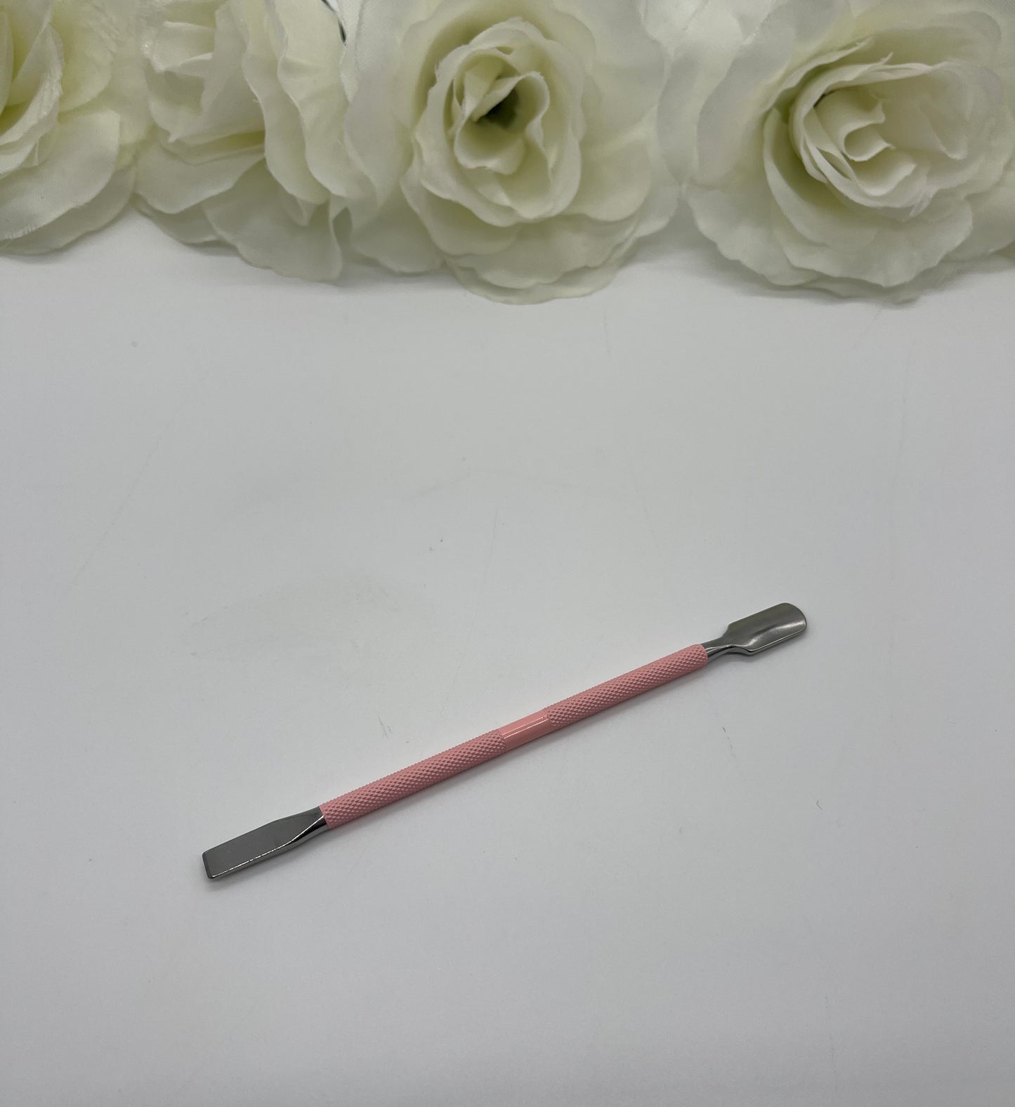 Pink metal cuticle pusher